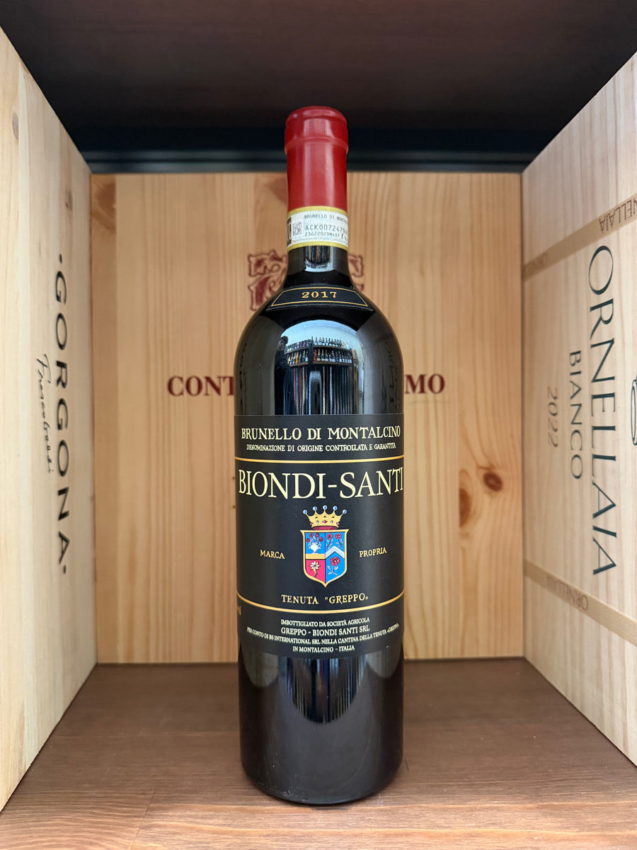 Bottiglia di Brunello di Montalcino 2017 Biondi Santi, vino rosso toscano in una bottiglia elegante.