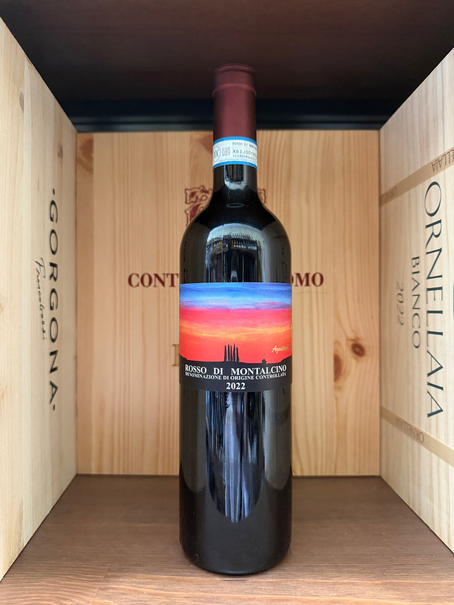 Bottiglia di vino rosso Agostina Pieri Rosso di Montalcino 2022 di Enoteche Toscane, con etichetta e tappo in evidenza.