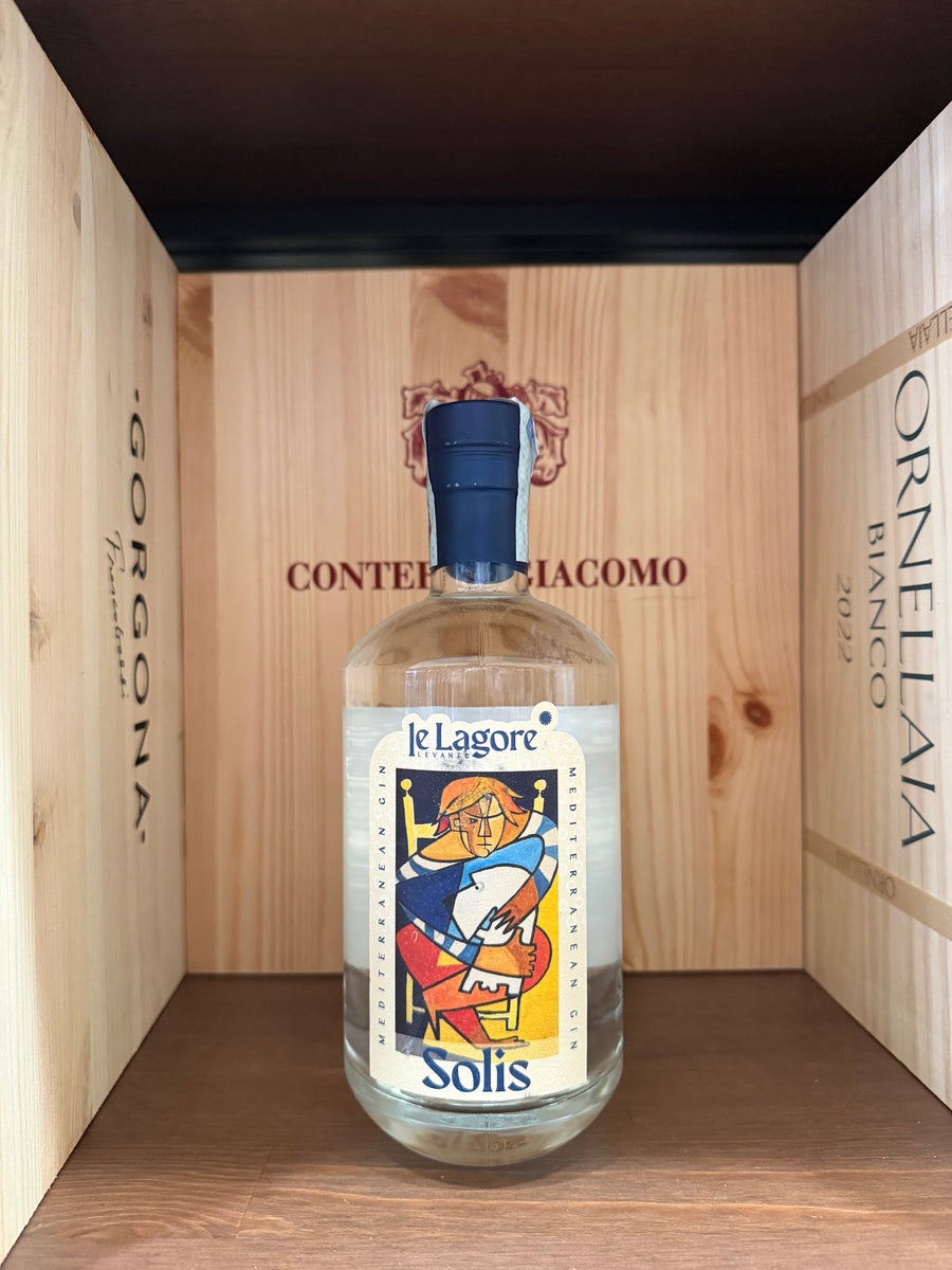 Bottiglia di gin Le Lagore Solis di Enoteche Toscane, con etichetta elegante e dettagliata, su sfondo neutro.
