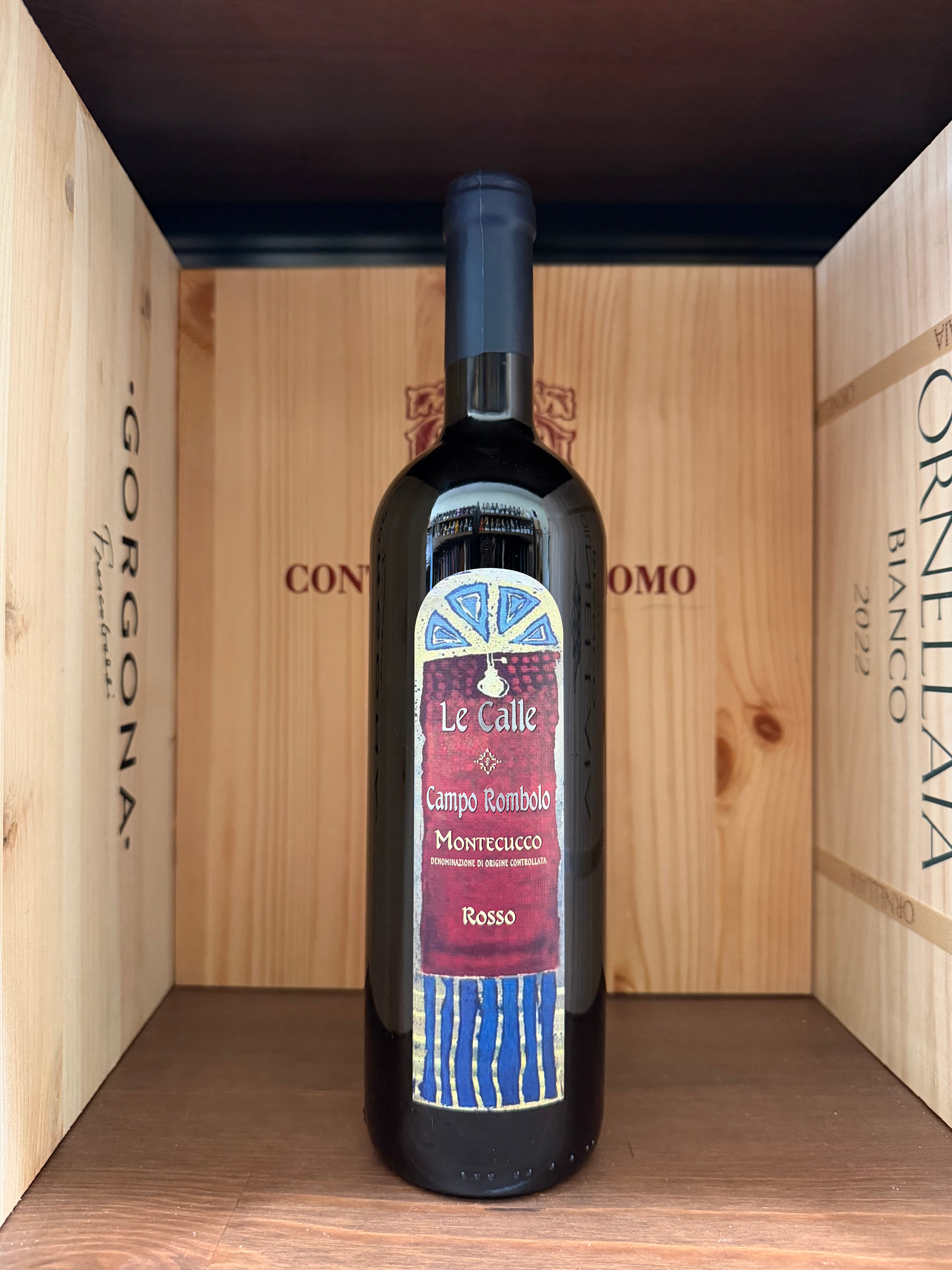 Calice di vino rosso Campo Rombolo 2021 Le Calle di Enoteche Toscane, bottiglia elegante con etichetta dettagliata.