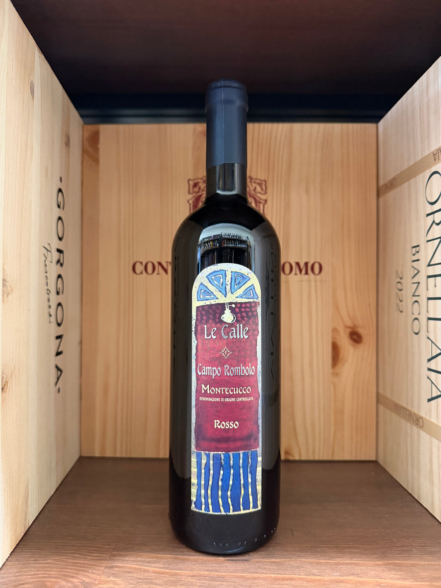 Calice di vino rosso Campo Rombolo 2021 Le Calle di Enoteche Toscane, bottiglia elegante con etichetta dettagliata.