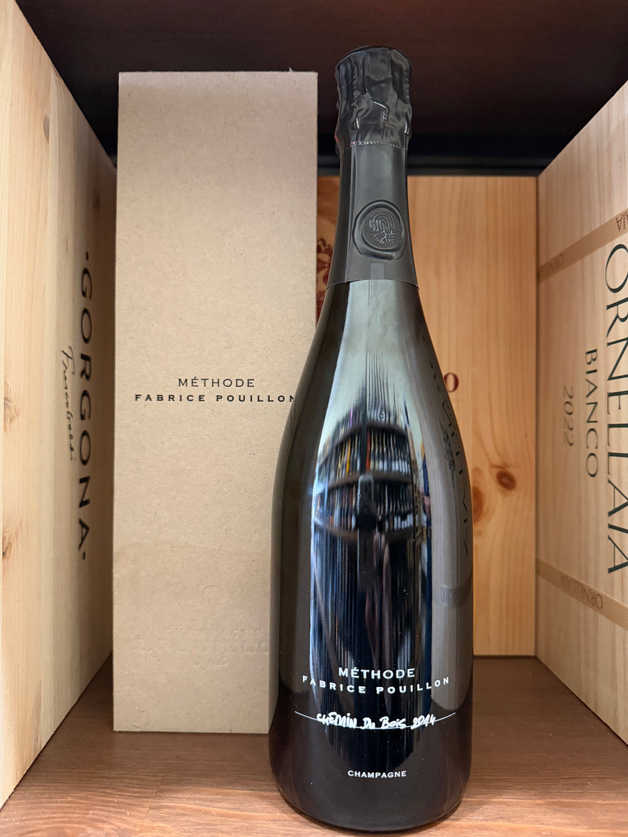 Bottiglia di vino Metodo Fabrice Pouillon Chemin Du Bois Millesime 2014 di Enoteche Toscane, etichetta elegante e dettagliata.