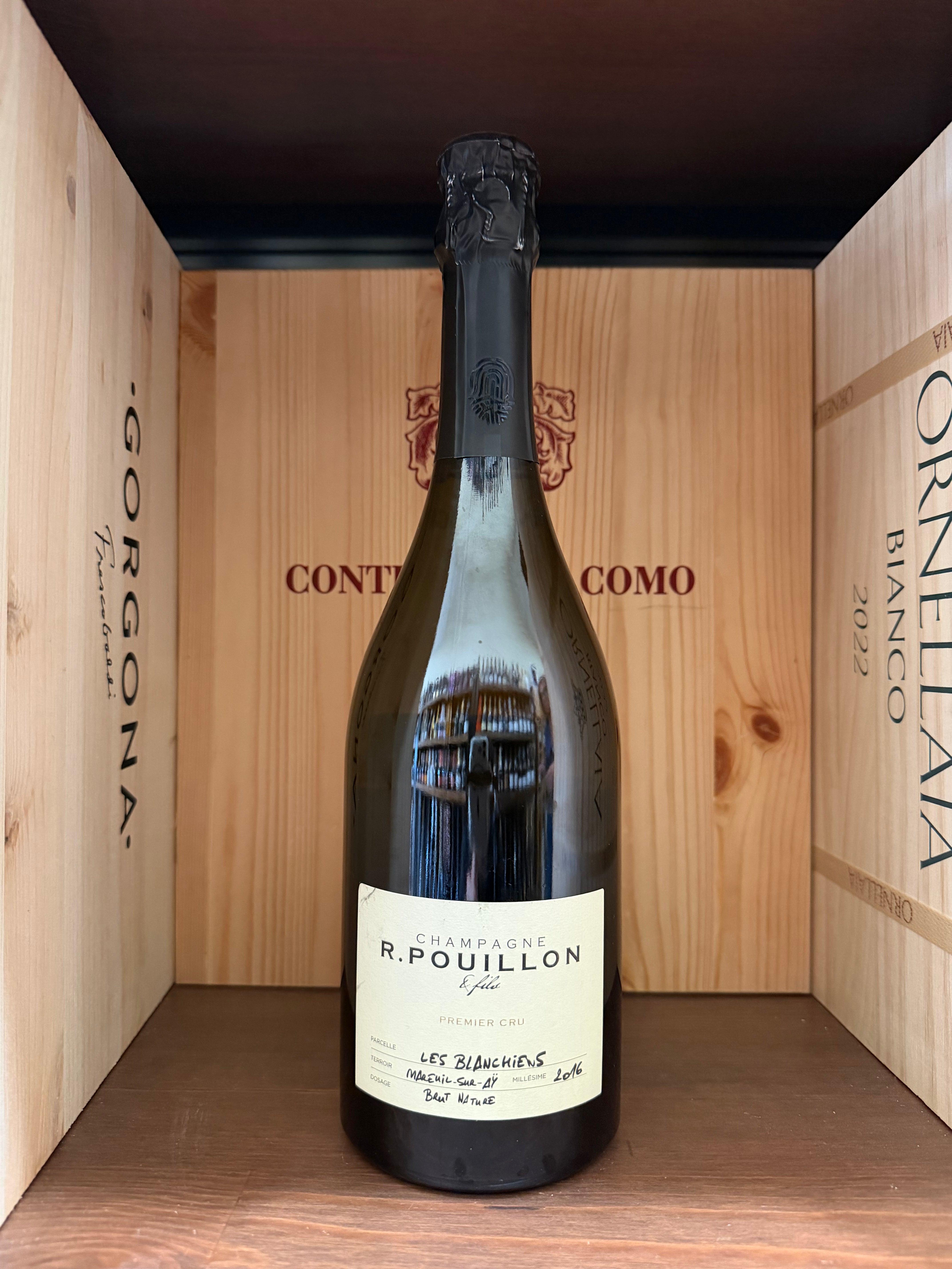 Bottiglia di spumante R.Pouillon Premier Cru Les Blanchies Brut Nature 2016 di Enoteche Toscane, con etichetta elegante.