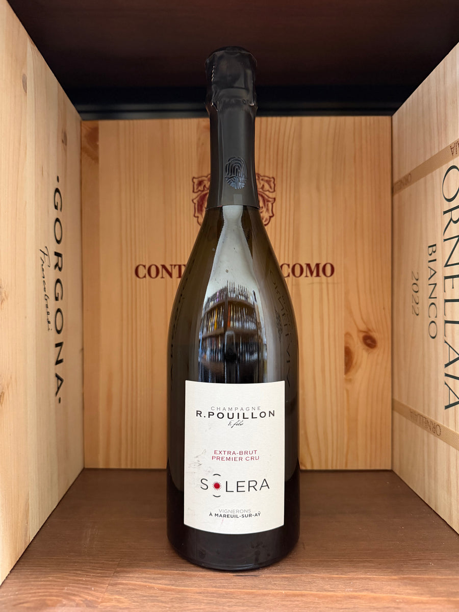 Bottiglia di vino spumante R.Pouillon Solera Premium Cru Extra Brut 2021 di Enoteche Toscane, etichetta elegante e dettagliata