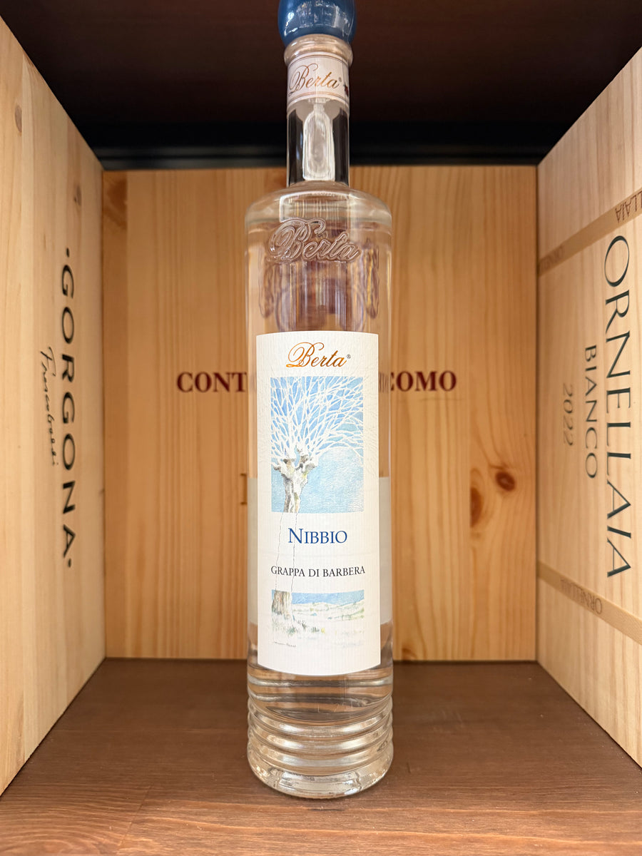 Bottiglia di grappa di Barbera Nibbio di Enoteche Toscane, con etichetta elegante e contenitore in vetro trasparente.