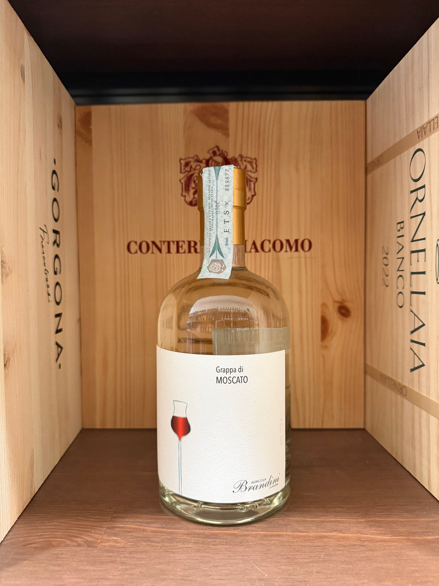 Bottiglia di Grappa di Moscato Brandini di Enoteche Toscane, bottiglia elegante e chiara con etichetta dettagliata.