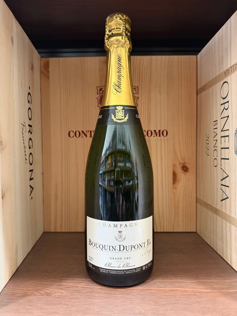 Bottiglia di Bouquin-Dupont Fils Gran Cru Blanc de Blancs, vino bianco di alta qualità, in una bottiglia elegante, vista frontale.