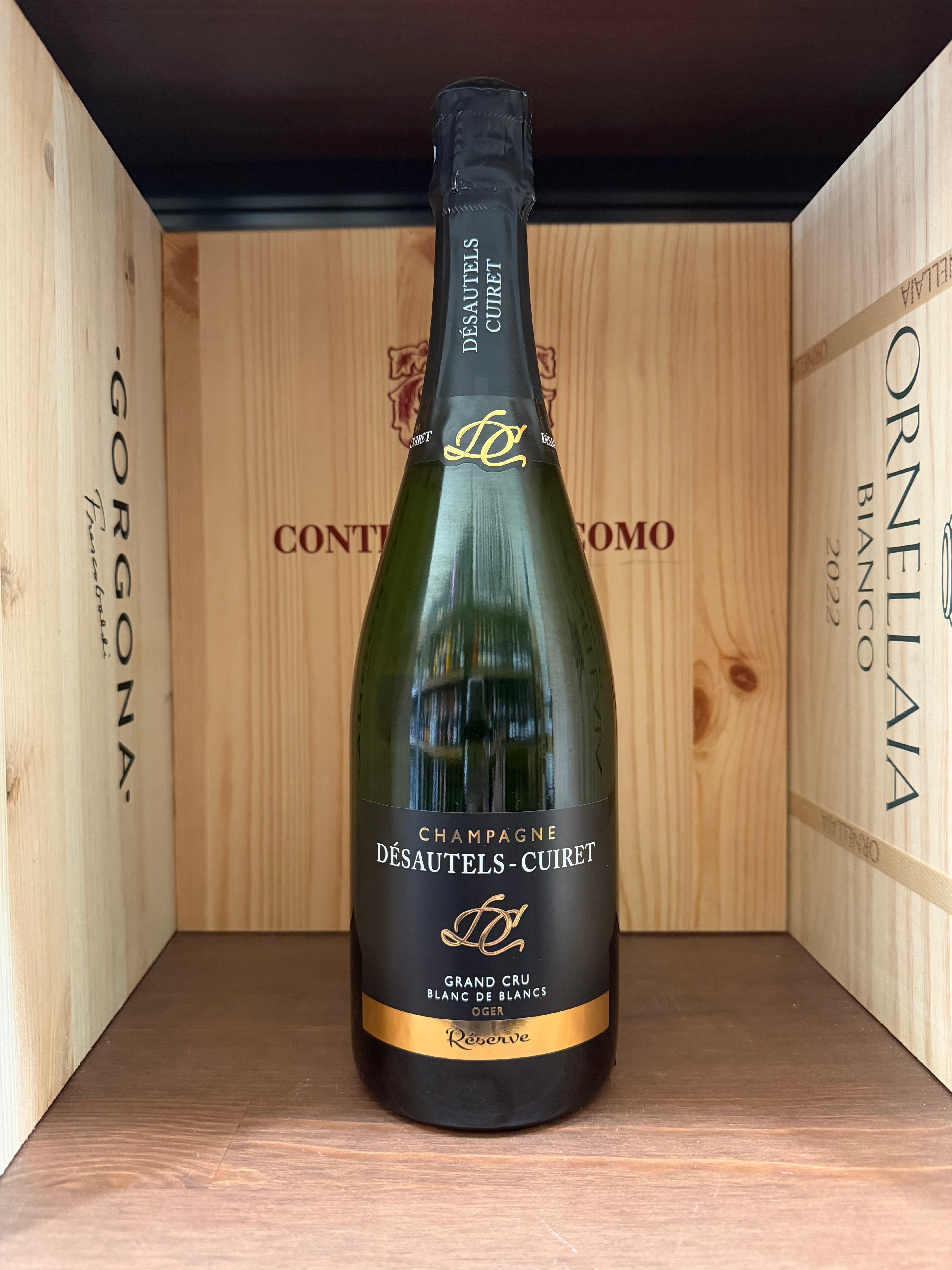 Spumante Blanc de Blancs Désautels-Cuiret Réserve Gran Cru, bottiglia elegante con etichetta dettagliata, vista fronte.