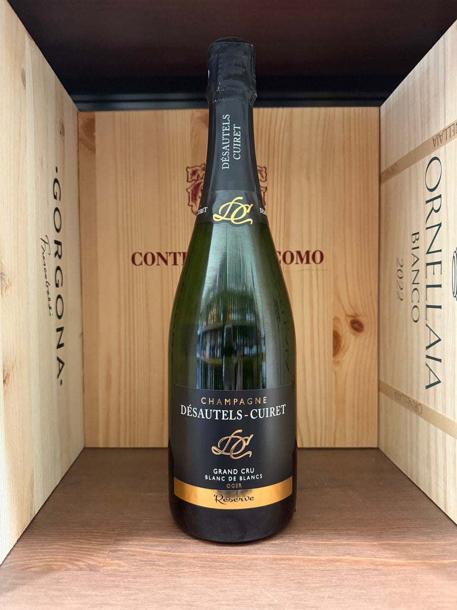 Spumante Blanc de Blancs Désautels-Cuiret Réserve Gran Cru, bottiglia elegante con etichetta dettagliata, vista fronte.